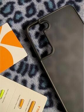 Torras Cell Cover Smokey Gray, orange/green keys . poss for a Samsung Galaxy S25